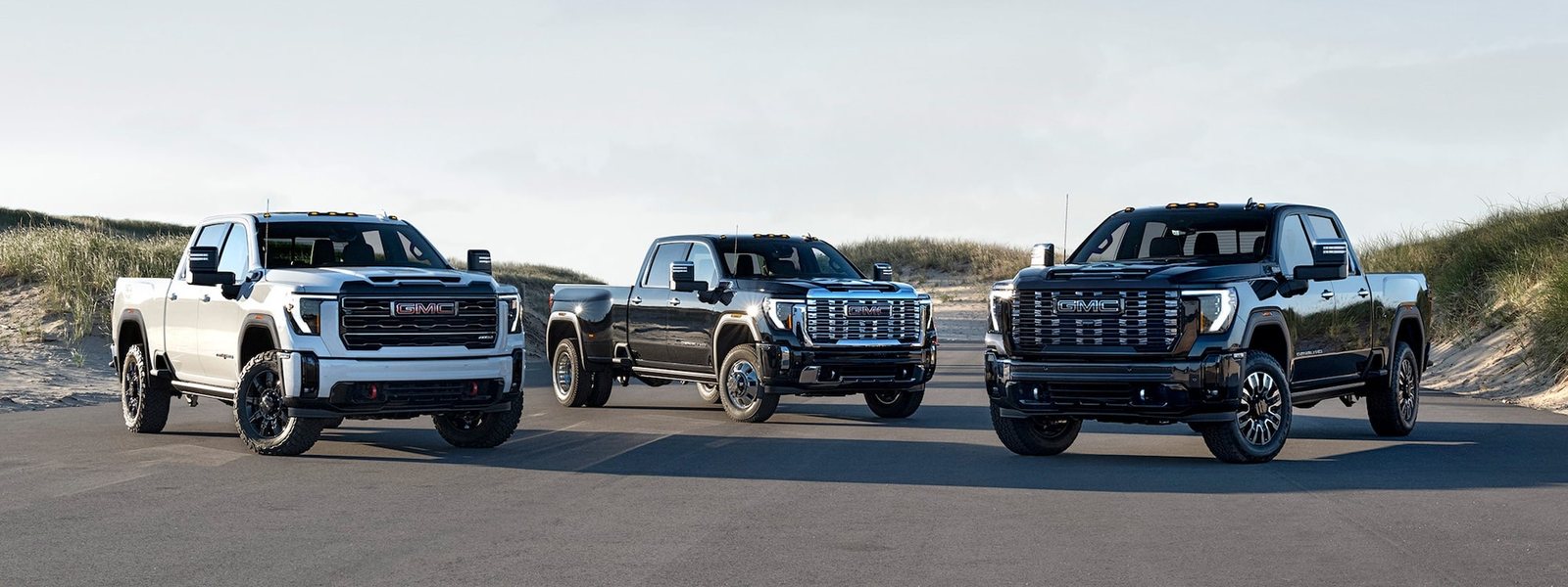 Three GMC Sierra HD pickups in AT4X, Denali and Denali Ultimate trim